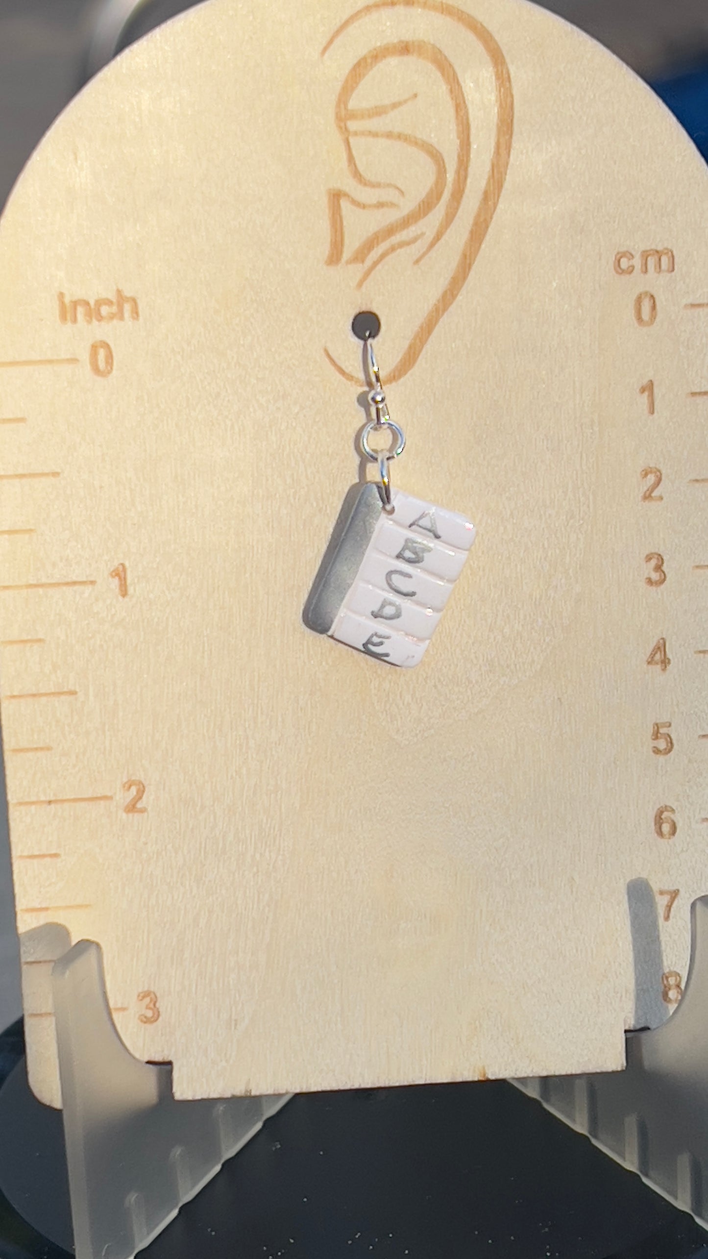 Looseleaf paper with silver detail earrings