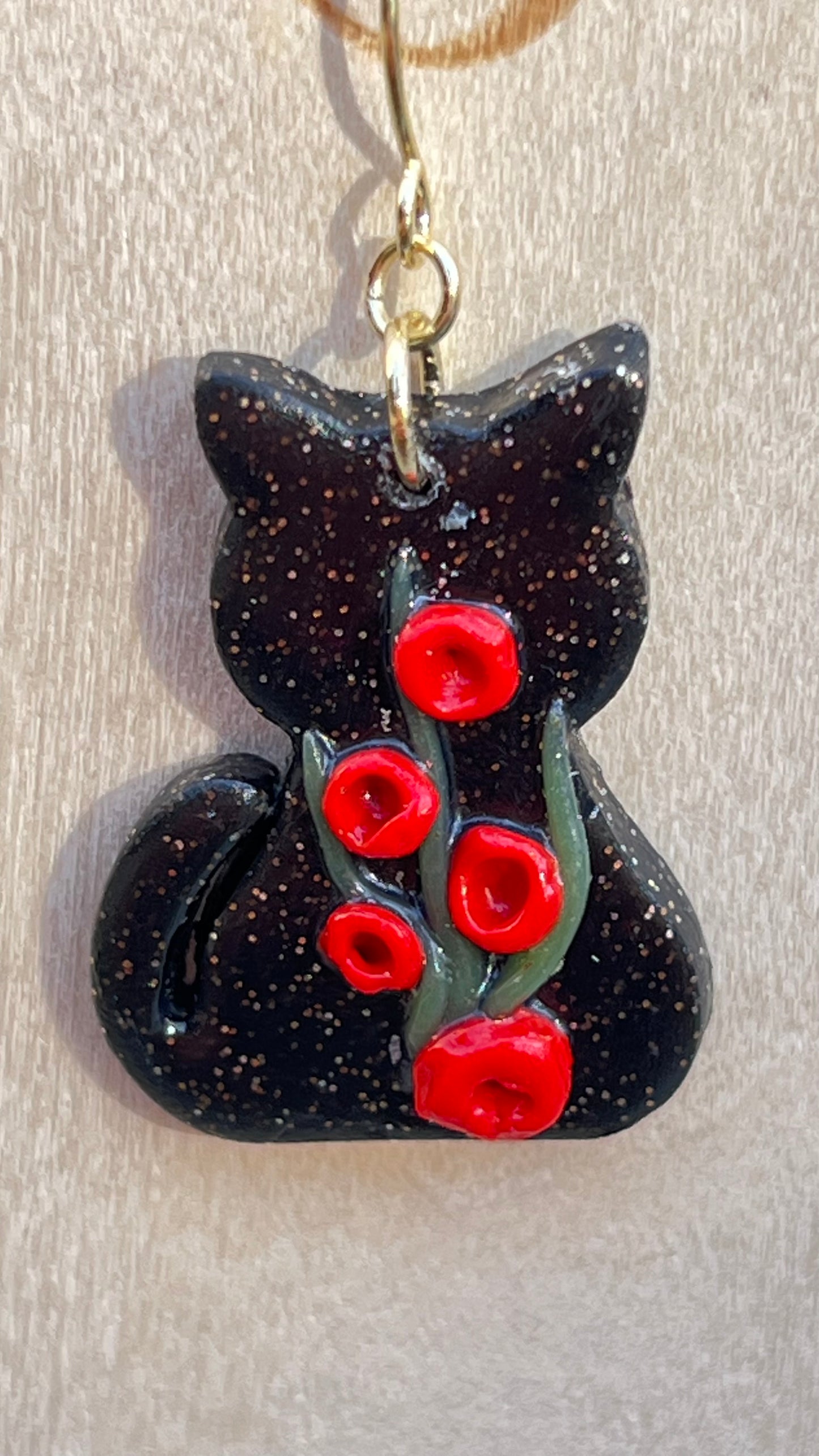 Black cats, red flowers dangling earrings