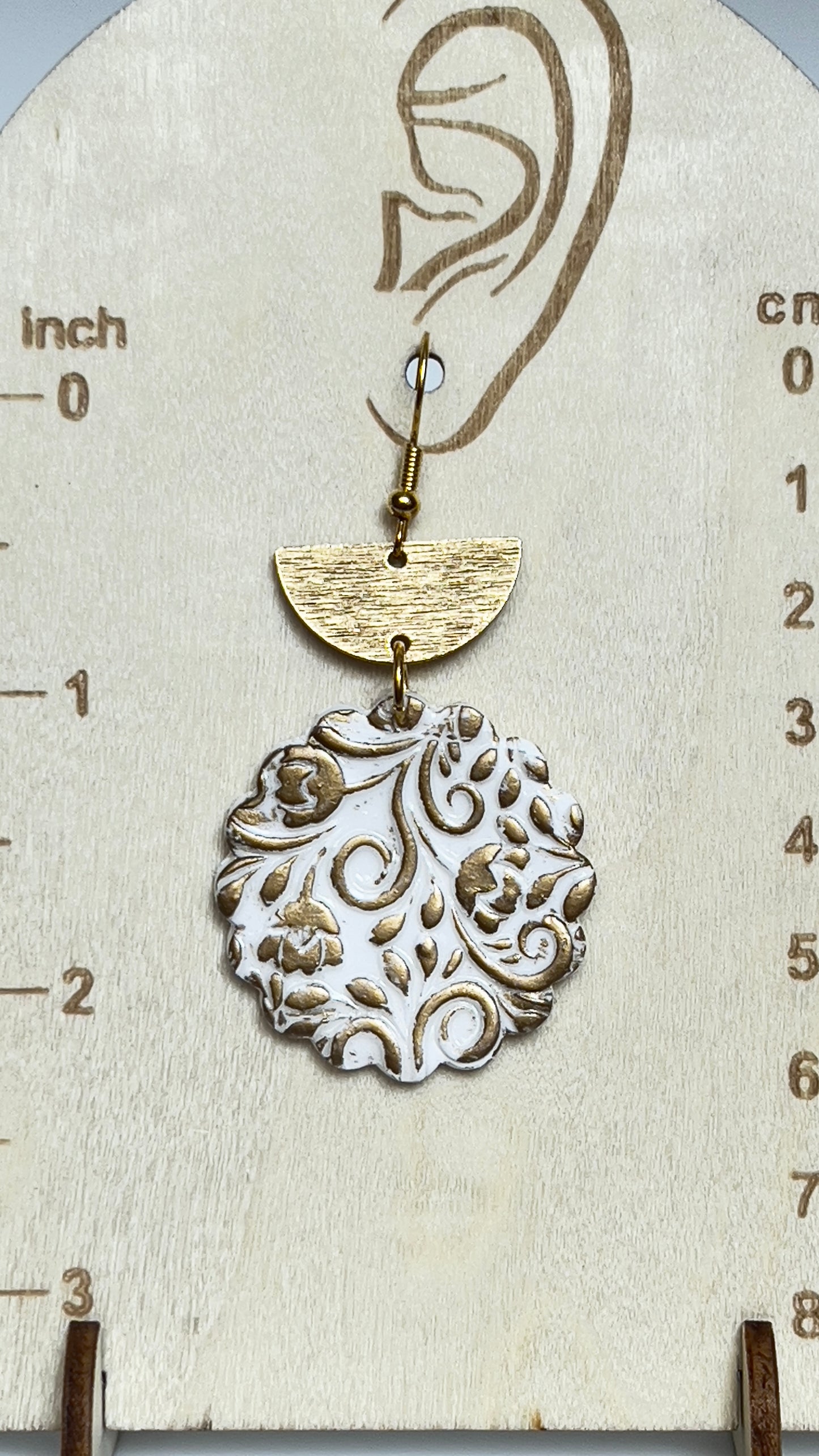 White and gold polymer clay handmade and hand painted dangling earrings. Gold tone charm and hypoallergenic hooks