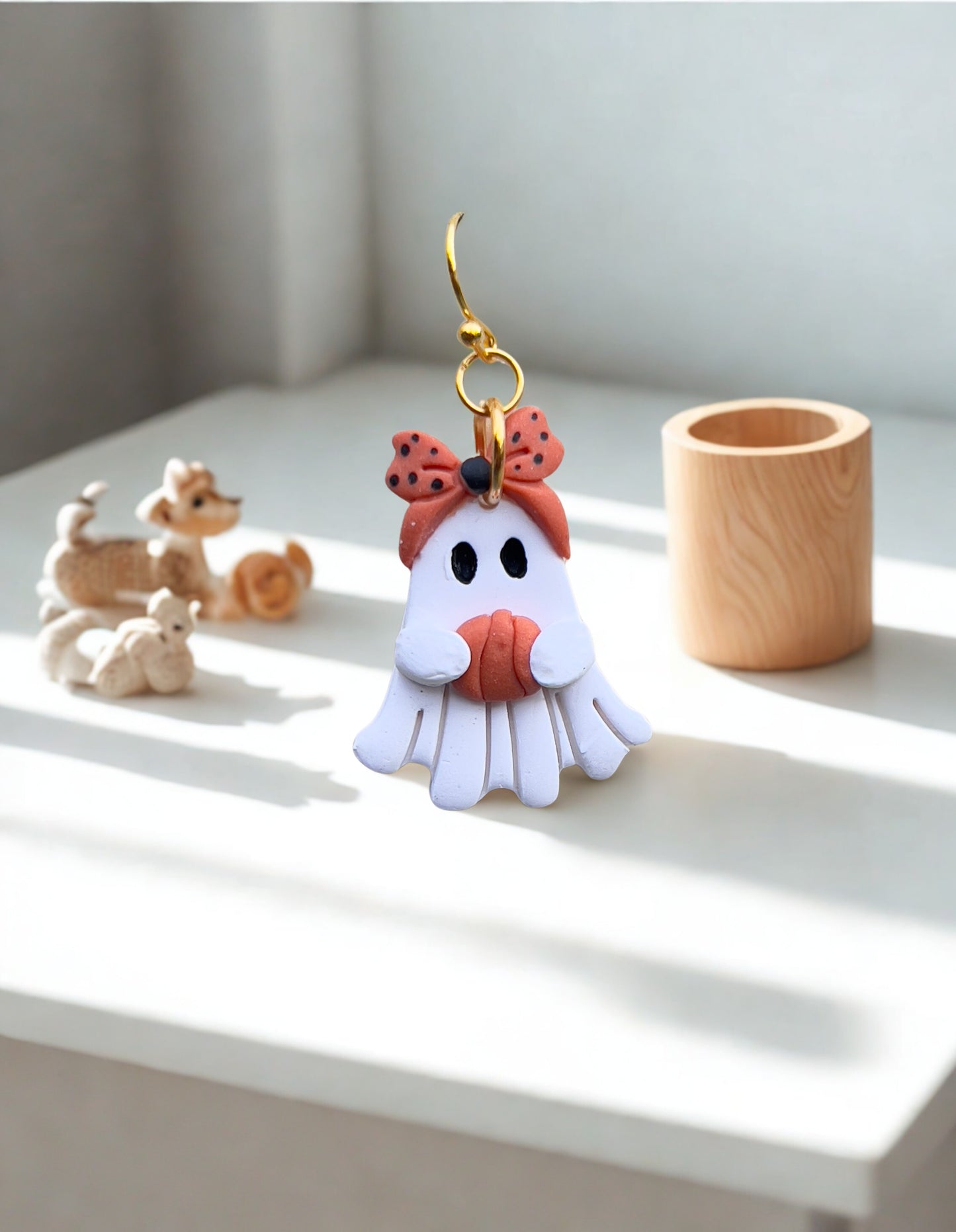 Ghost holding a pumpkin polymer clay light weight dangle earrings