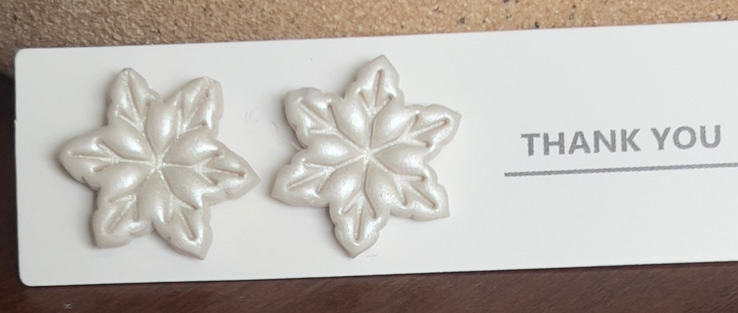 White snowflake stud earrings