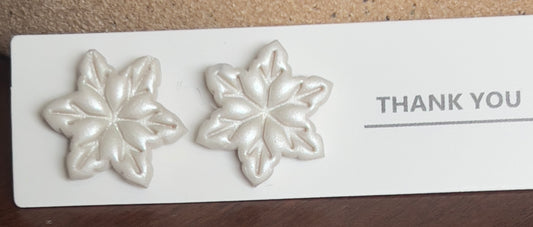 White snowflake stud earrings