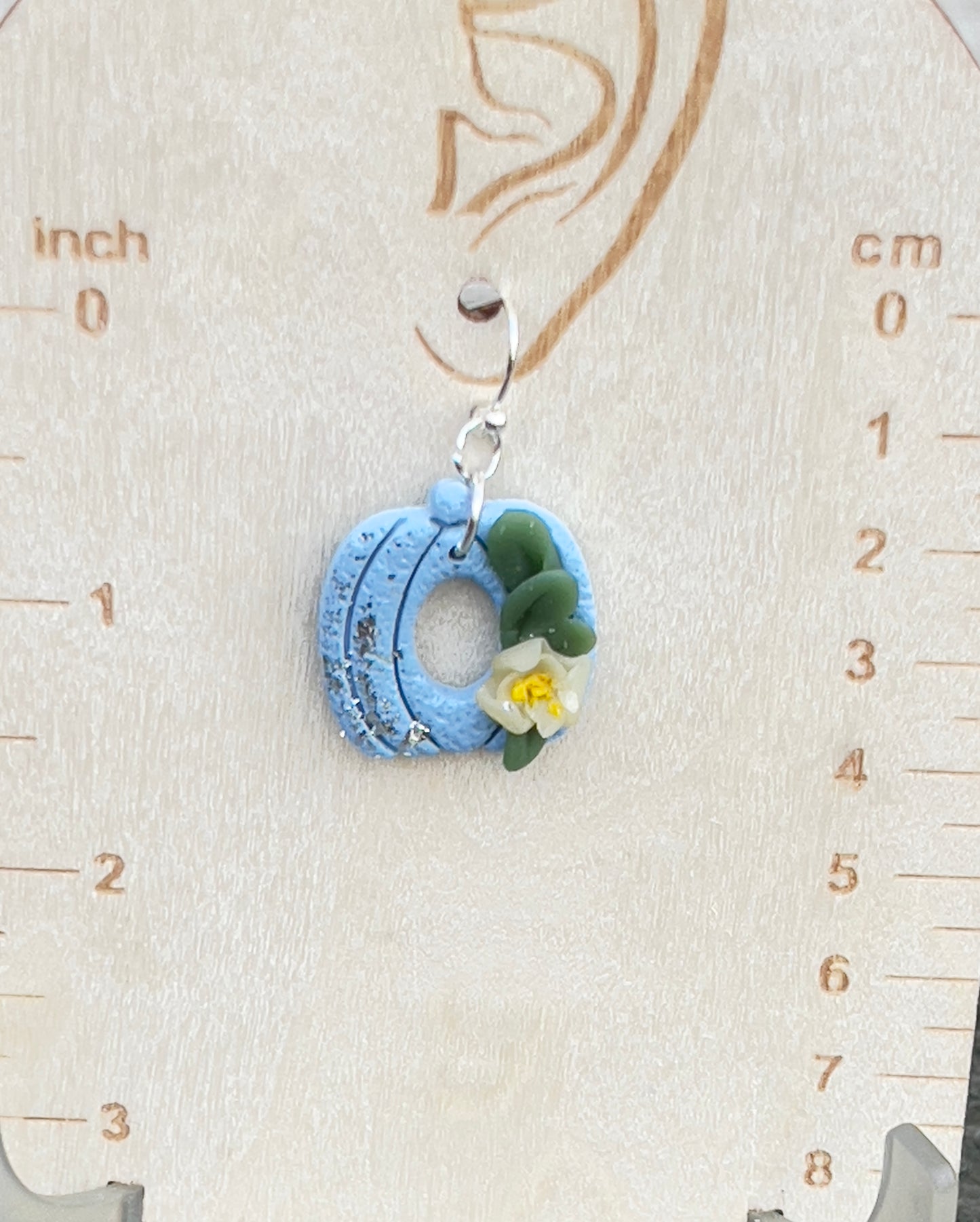 Blue Pumpkin with a light yellow lower and green leaves