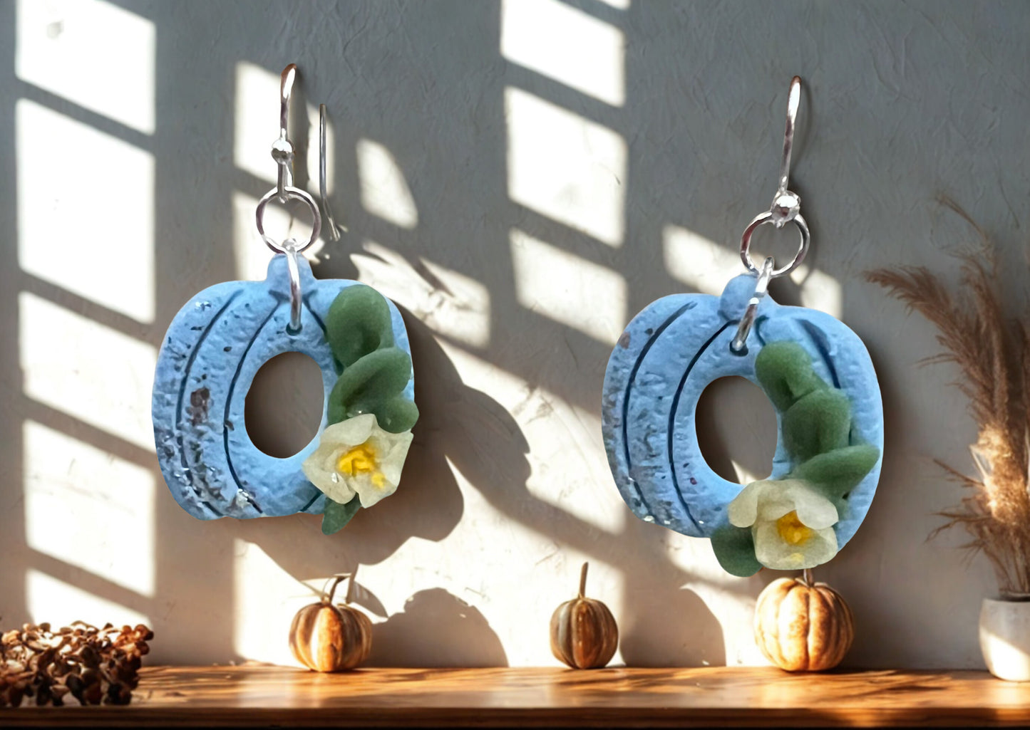 Blue Pumpkin with a light yellow lower and green leaves