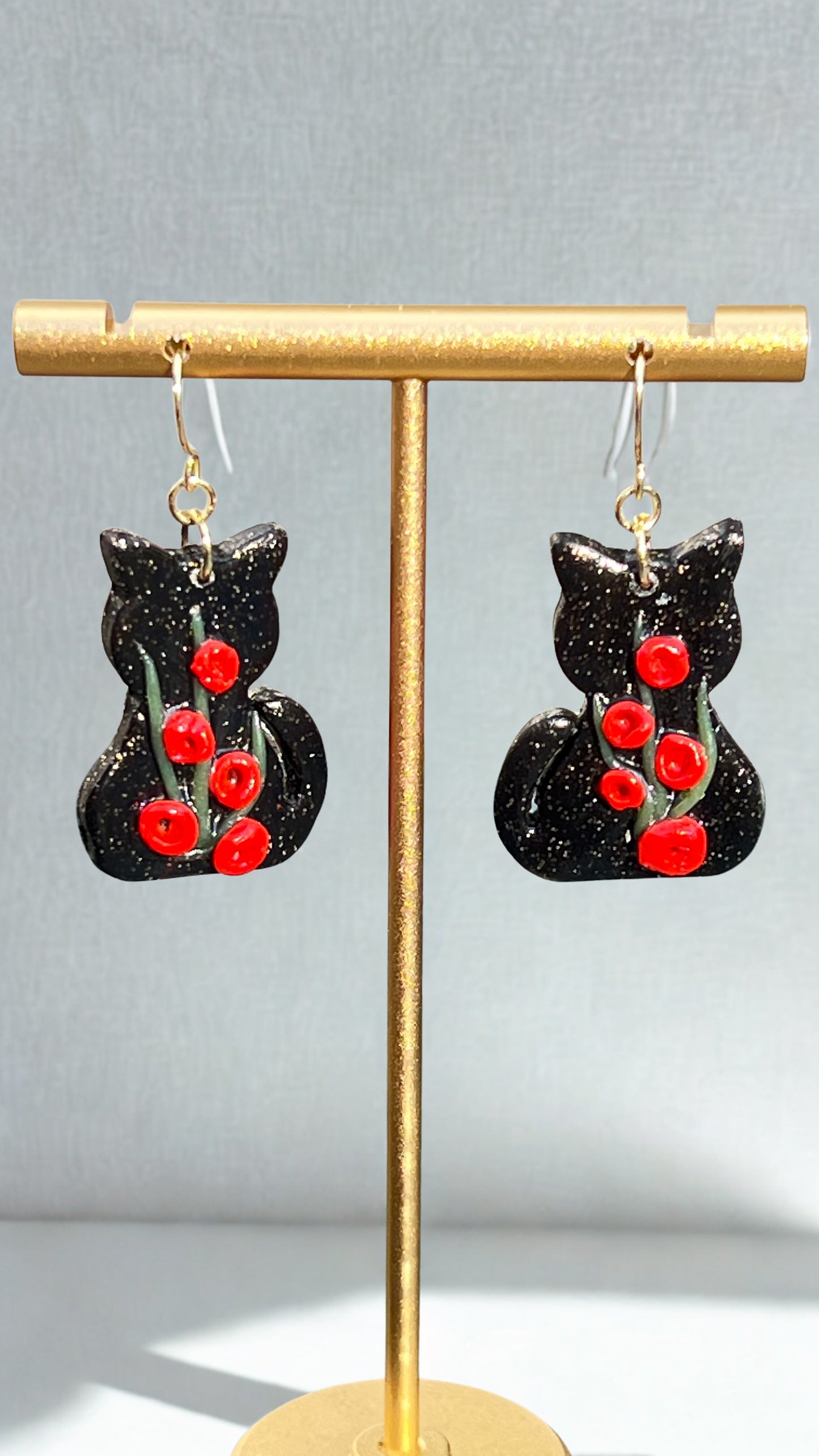 Black cats, red flowers dangling earrings