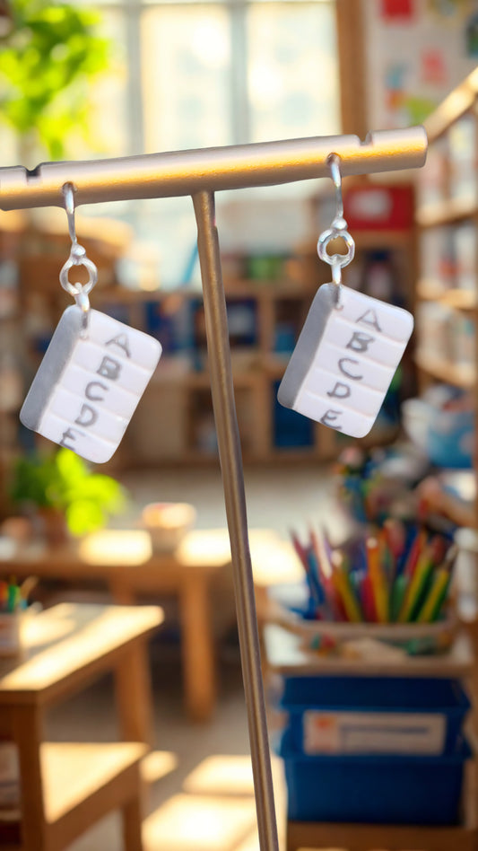 Looseleaf paper with silver detail earrings