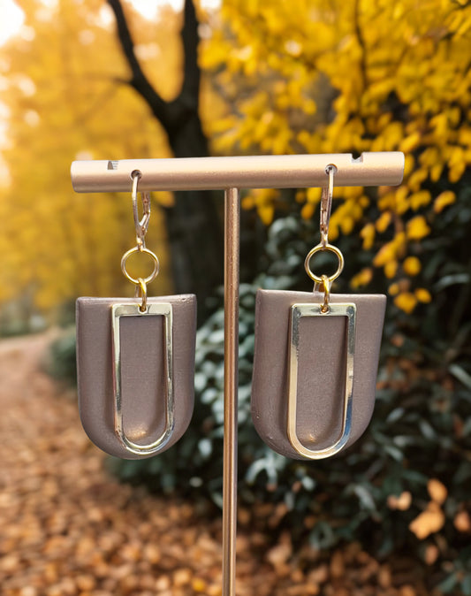 Chocolate Brown with a gold tone charm