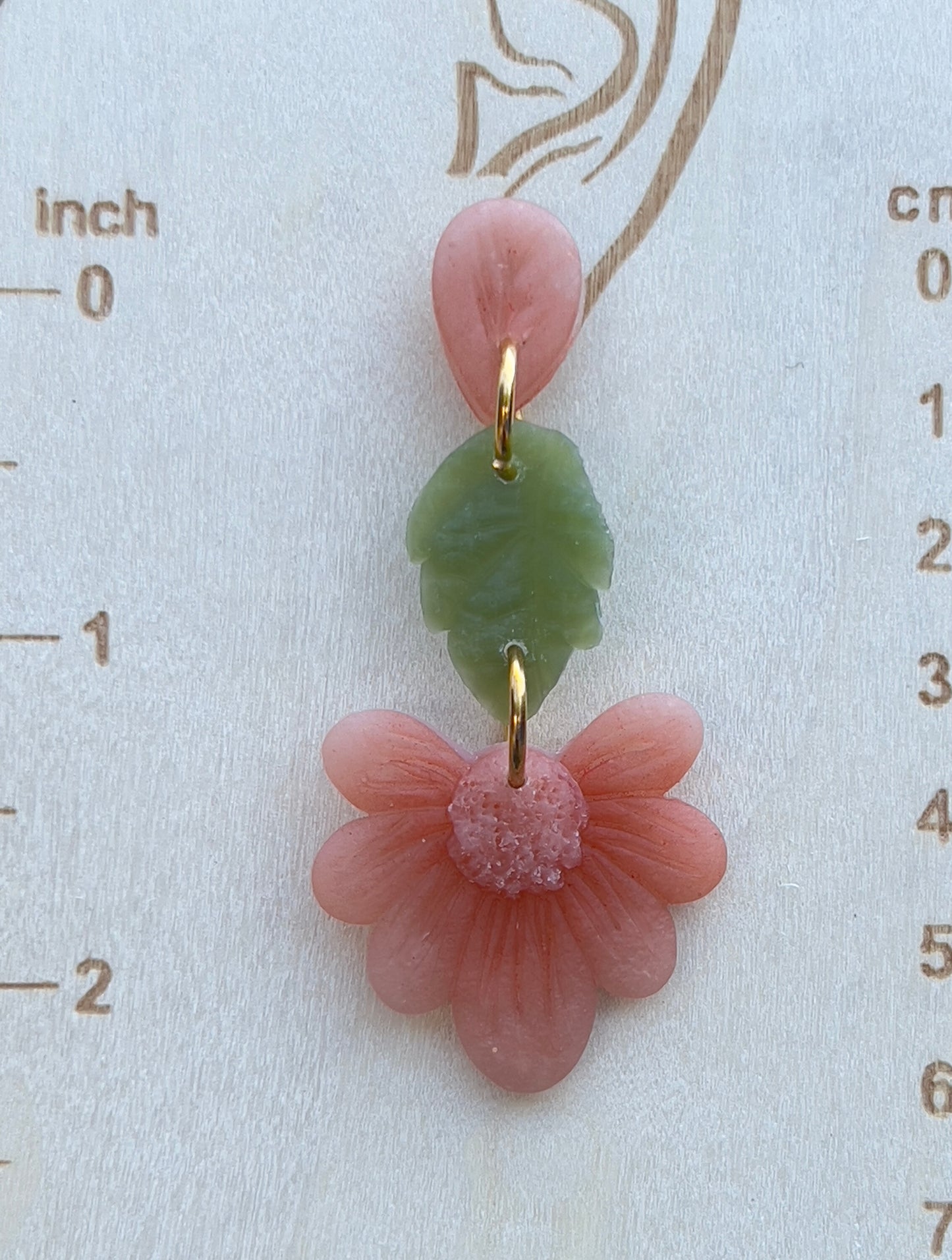 Handmade Peachy/Orange Flower with a green leaf