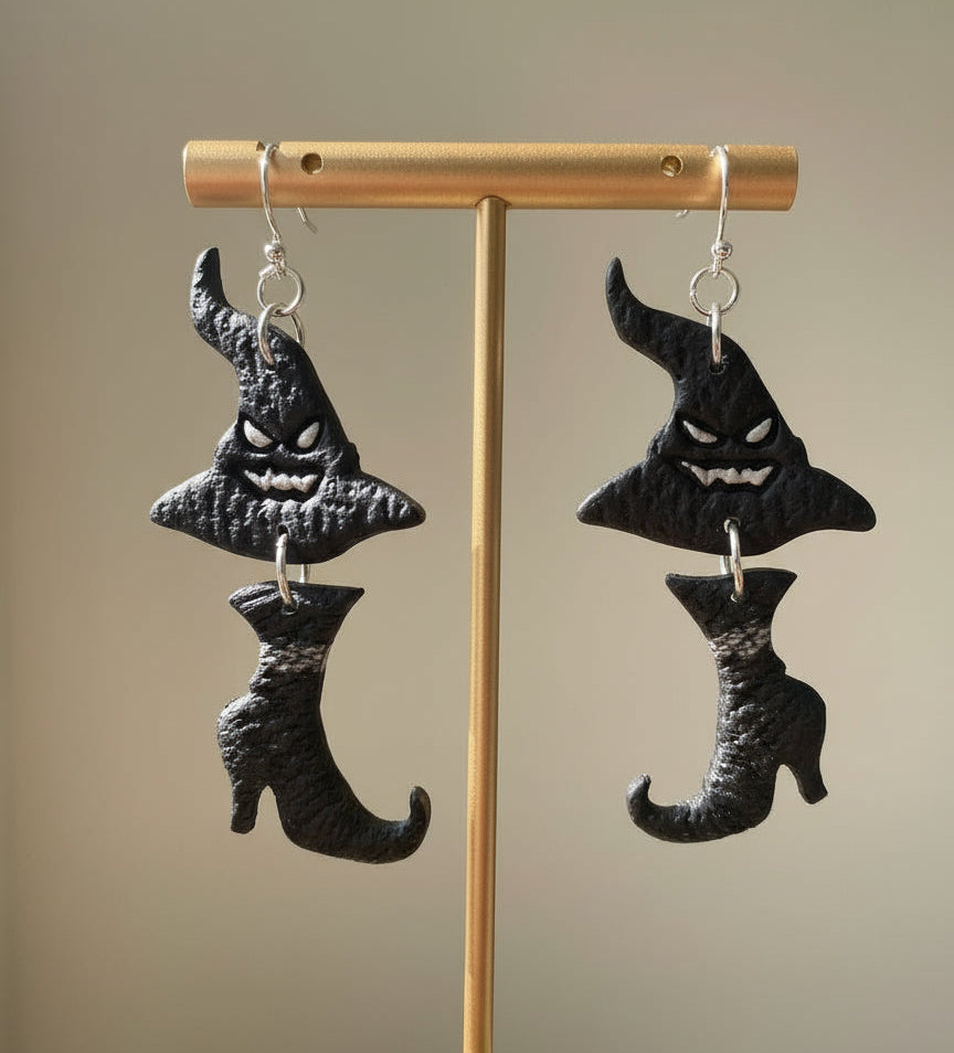 Witch’s boot wearing a witch’s hat dangle earrings