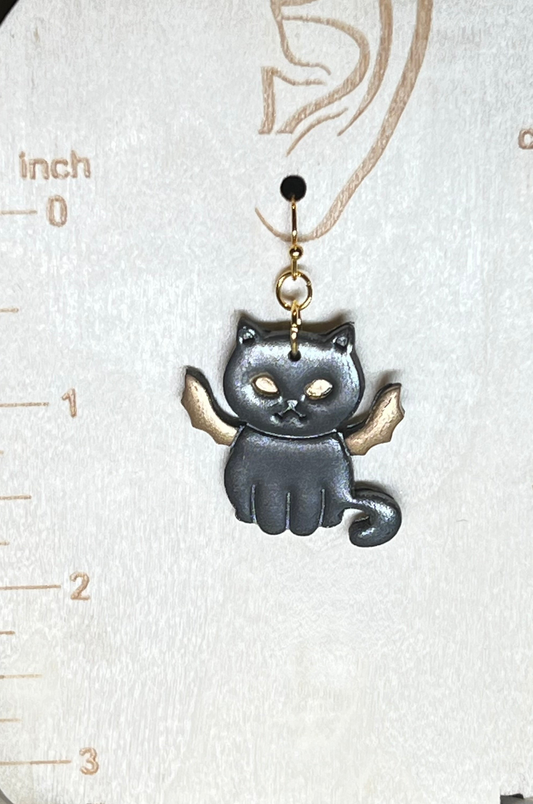 Halloween earrings of a black cat with gold bat wings