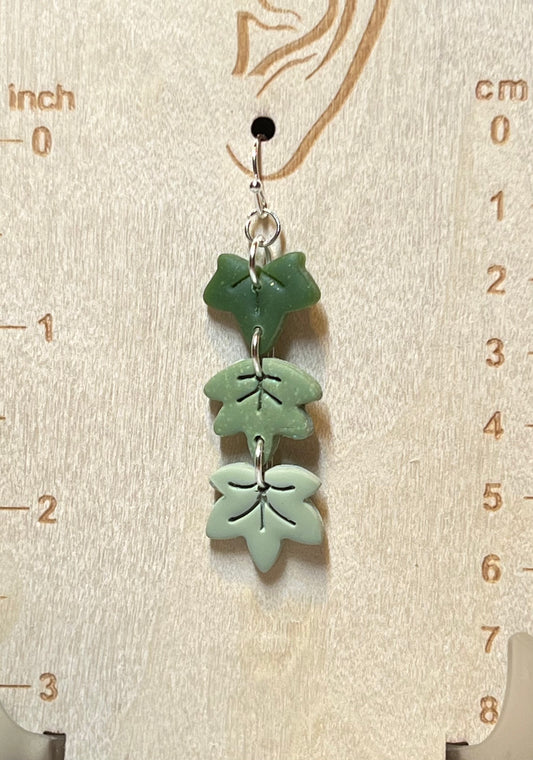 Three gradient green maple leaves